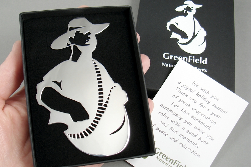 Stalowe zakładki do książek w kształcie logo firmy